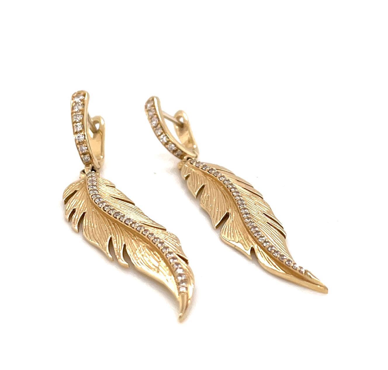 Feather drop earrings with huggies on top