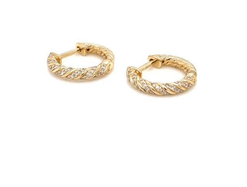 A yellow gold huggie with twisted goldwork.