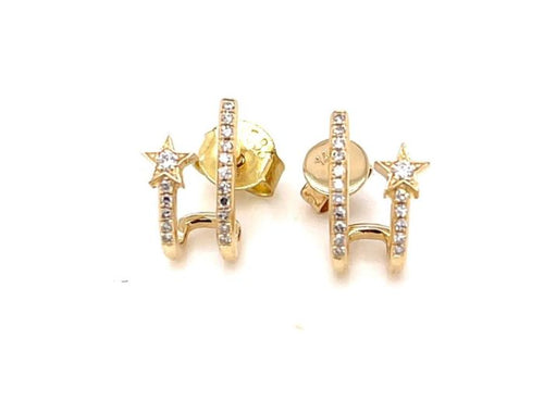 Gold stud earring with a gold star charm that extends outward and is studded with diamonds.