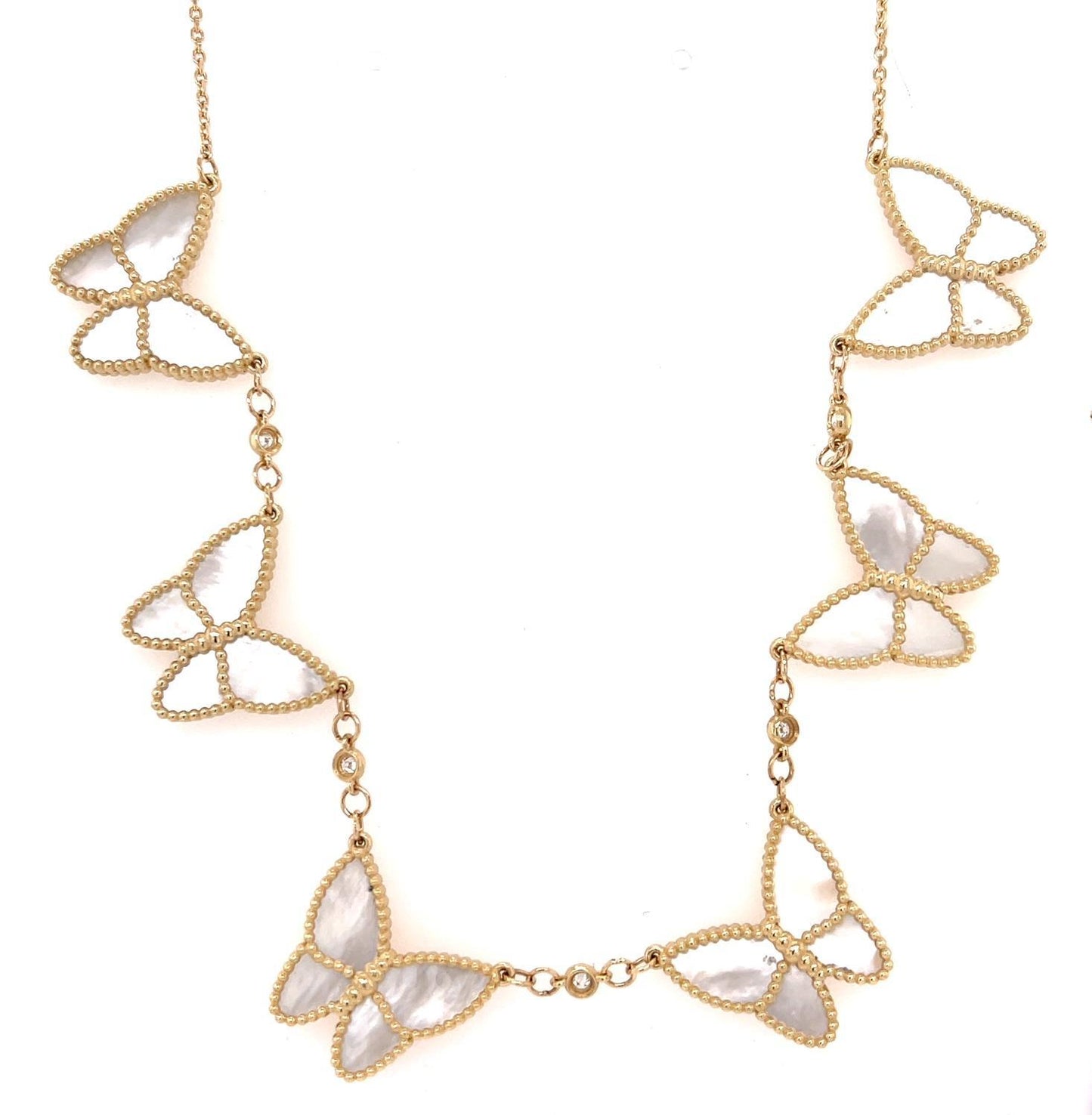 We are utterly charmed by this asymmetrical charm necklace! PRICE: .00
