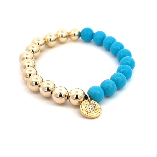 Gold, turquoise ball with charm