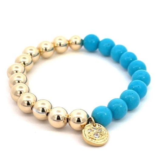 Gold, turquoise ball with charm